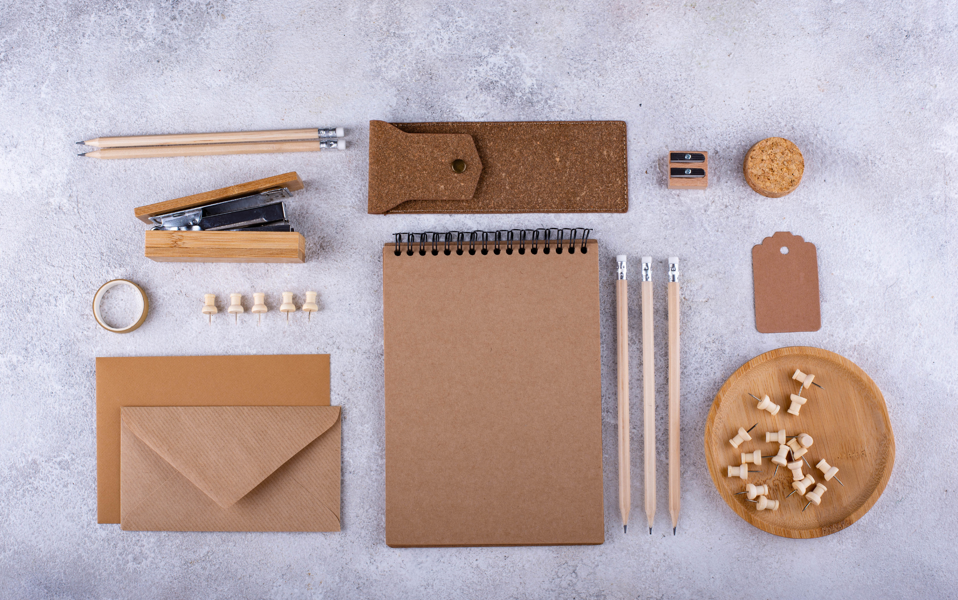 Plastic-free writing tools including a bamboo pen and notebook.